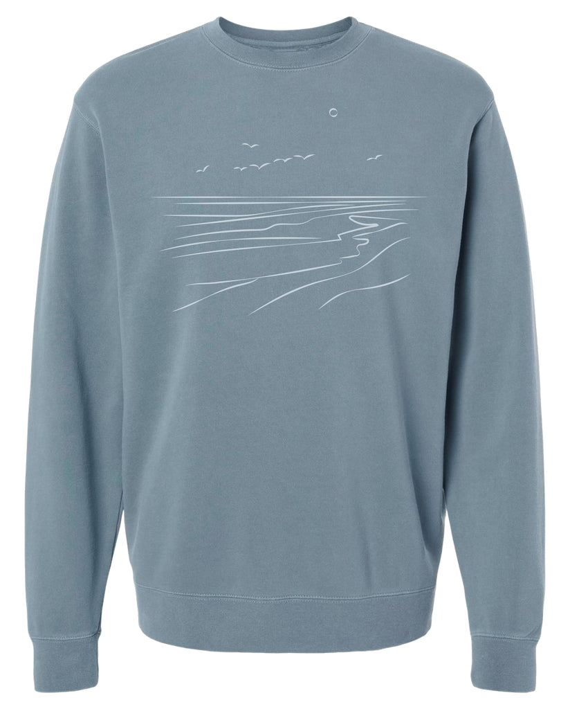Soft and beautiful pigment dyed unisex crew neck sweater with the ocean shore hand drawn on it